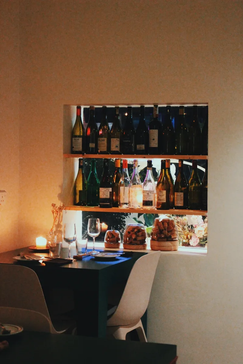 Warm light and bottles at UNWINED PLUS